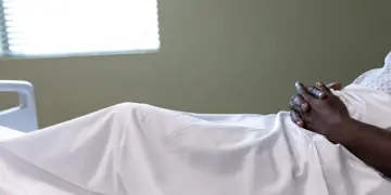 Generic Black Patient In Hospital Bed